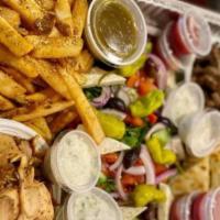 Gyro Plate For 4 · Lamb and beef gyro meat, chicken gyro meat, pita bread, greek salad, french fries and tzatziki