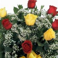 Love & Friendship · Stunning arrangement of six red and six yellow long stem roses. This favorite gift in a glas...