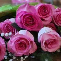 One Dozen Pink Roses Bouquet · One Dozen Pink Roses wrapped bouquet. Surprise someone with these beautiful pink roses.