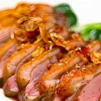 Boneless Duck · Special made gravy on the top of boneless duck and mixed vegetables.