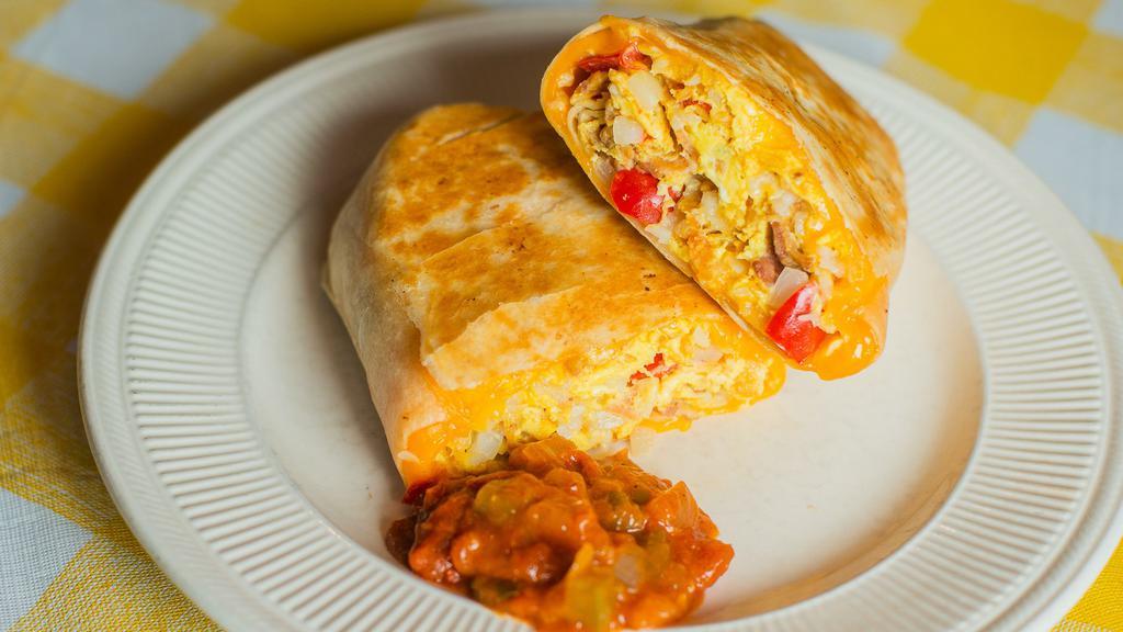 Combo Breakfast Burrito · Scrambled eggs, bacon, sausage, grilled bell peppers, grilled onions, tater tots and cheddar cheese wrapped in a flour tortilla. Served with a side of salsa.