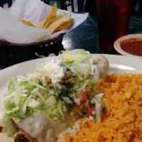 Enchiladas Supreme · One chicken one beef enchiladas topped with cheese, lettuce, guav=camole, tomato, and sour c...