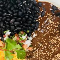 Mole Ranchero · Grilled chicken breast topped with mole sauce. Served with rice or beans and tortillas.