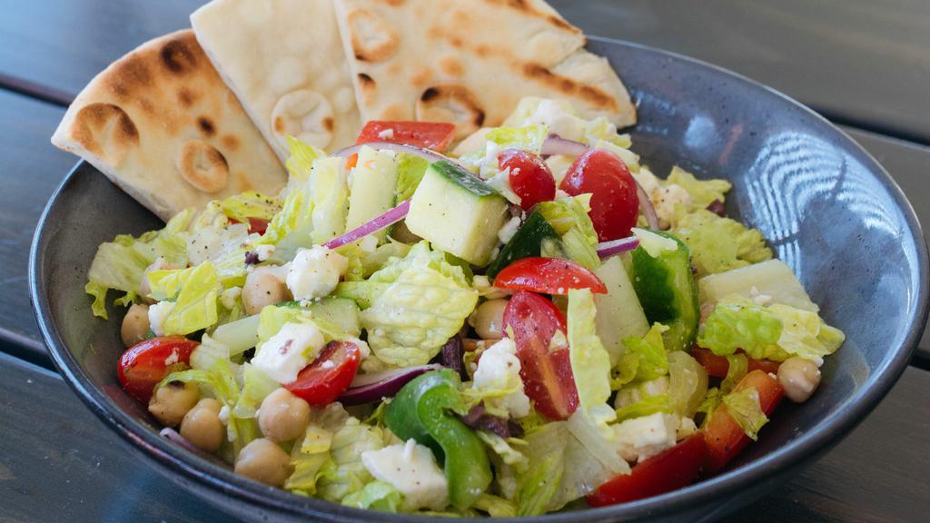 Chop Salad · Romaine, chickpeas, olives, feta cheese, cucumber, red onion, bell pepper, tomato, pita crisps.