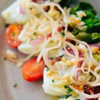 Ali’S Wedge · Little gems, house smoked bacon, chopped egg, pickled red onion, tomato, blue cheese dressin...