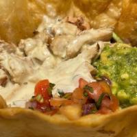 Fridas Bowl  · Fried tortilla bowl, grilled chicken, rice, black beans, queso , lettuce, pico de gallo, gua...