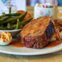 Cajun Meatloaf And Mashed Potatoes · A spicy ground chuck loaf over mashed potatoes and topped with brown gravy and your choice o...