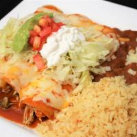 Enchiladas Mexicanas · Three chicken enchiladas topped with red sauce,
lettuce, sour cream, guacamole and tomatoes....