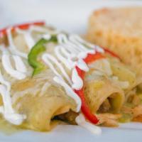 Enchiladas Verdes · Three shredded beef enchiladas topped with
green sauce, lettuce, sour cream and tomatoes.
Se...