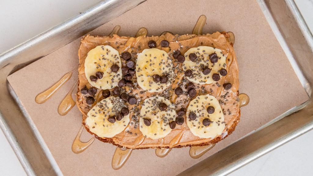 Peanut Butter Toast · Topped with sliced bananas, vegan chocolate chips, chia seeds and agave, on organic multi-grain bread.