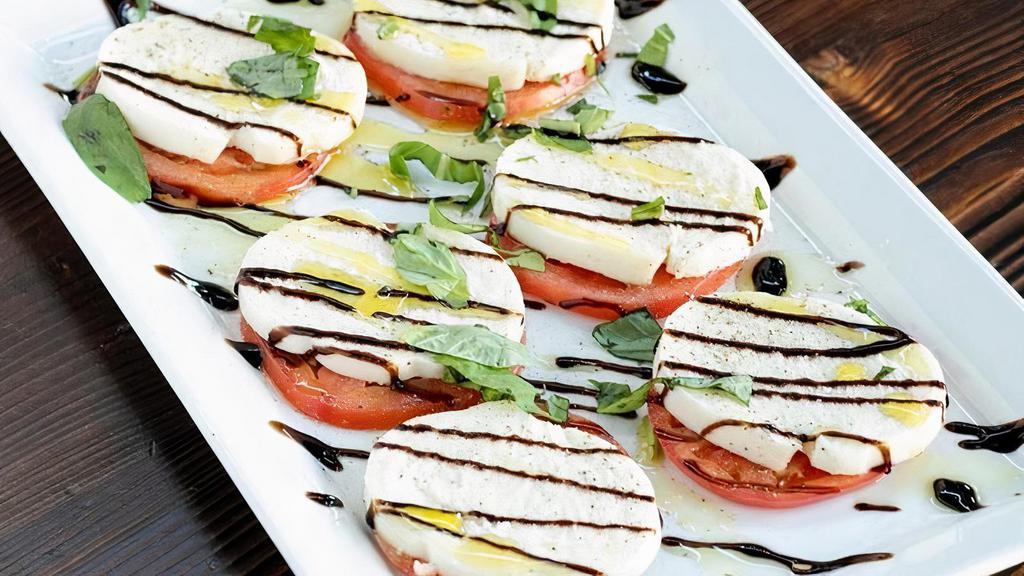 Caprese · Vegetarian's favorite. Fresh Mozzarella, tomatoes, and basil. Drizzled with olive oil and our house made balsamic glaze.