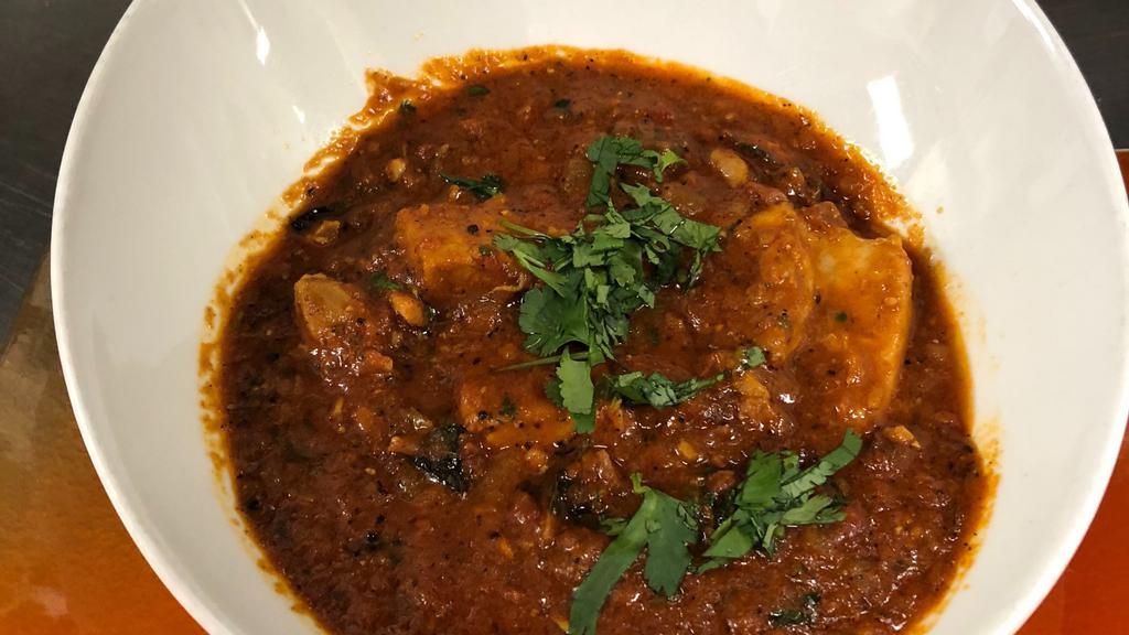 Chicken Kerala Curry · Chicken Simmered in Coconut Curry Sauce, Mustard, Dried Red Chilies, Curry Leaves