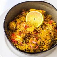Chicken Biriyani · Chicken, Basmati Rice, Seasoned With Saffron, Iris Water & Delicate Spices