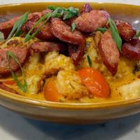 Shrimp & Grits · Gulf shrimp, creamy citrus sauce, cherry tomatoes, white cheddar jalapeño grits. Add grilled...