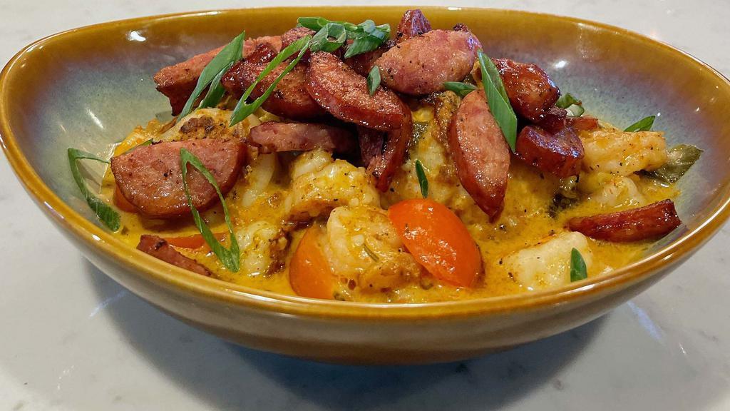 Shrimp & Grits · Gulf shrimp, creamy citrus sauce, cherry tomatoes, white cheddar jalapeño grits. Add grilled andouille sausage for an additional charge.