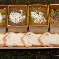 Taste Of New Orleans (Enjoy All Four) · Crawfish étouffée, creole jambalaya,duck andouille & black-eyed pea gumbo,red beans & rice.