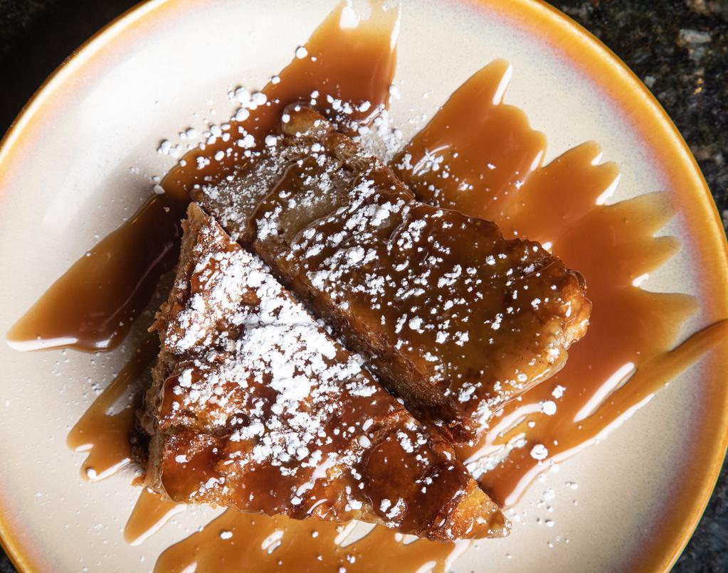 Curio Bread Pudding · Traditional new orleans bread pudding with bourbon sauce.