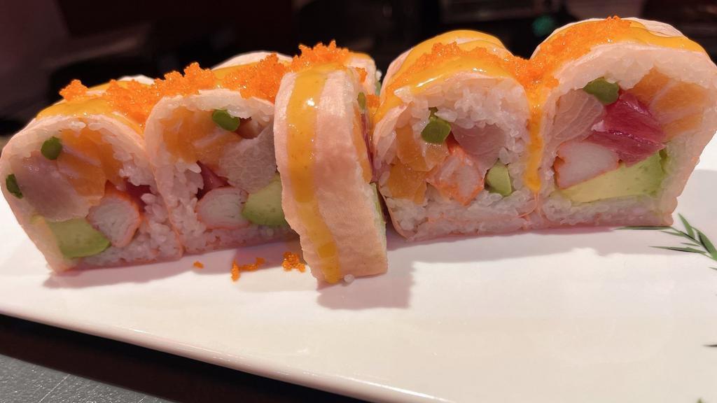 Paradise Roll · Soy paper, tuna, salmon, yellow tail, asparagus, avocado, crab, masago with spicy mayo.(8 piece jumbo roll)