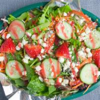 Strawberry Summer Salad · STRAWBERRIES, FETA CHEESE, SPINACH, MIXED GREENS, CUCUMBER, CARROTS, TOMATOES, WALNUTS, DRIE...