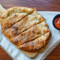 Greek Calzone · Olive oil base with black olives, feta cheese, fresh garlic, tomato, red onion bell peppers....