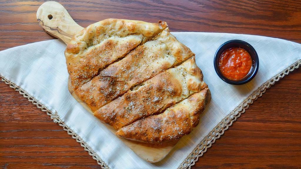 New York Veggie Calzone · Mozzarella, ricotta, spinach, broccoli, zucchini, bell pepper, red onion, fresh garlic drizzled with extra virgin olive oil. Parmesan with basil & oregano. Marinara on the side.