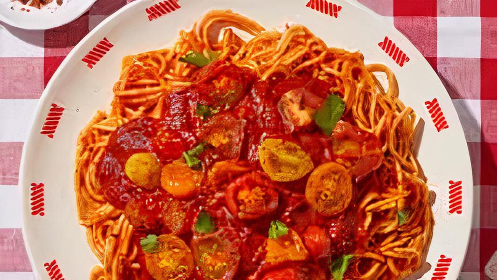Spaghetti Marinara · Classic italian spaghetti with marinara sauce served with freshly baked breadsticks, with marinara sauce topped with mozzarella.