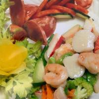Seafood Delight · Jumbo shrimp, scallop, crab meat, fresh vegetables in white sauce.