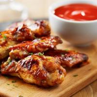 Sweet Teriyaki Wings · Tangy sweet teriyaki sauce topped on a batch of classic chicken wings.
