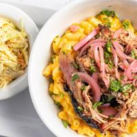 Fern Bowl · Mac 'n Cheese with your choice of pulled pork or chicken, pickled onion and cilantro. Garnis...