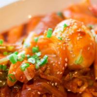Ddukbokki · Sautéed rice cakes, fish cakes, cabbages, onions, carrots, and hard-boiled egg in a spicy re...