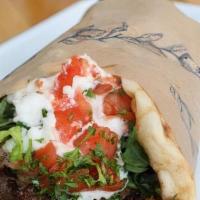  Steak Wrap · Grilled Ribeye cuts into strips on Greek pita bread topped with melted mozzarella cheese, ca...