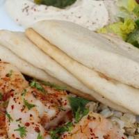 Grilled Shrimp Plate · Served with brown rice, mini greek salad, hummus and pita.