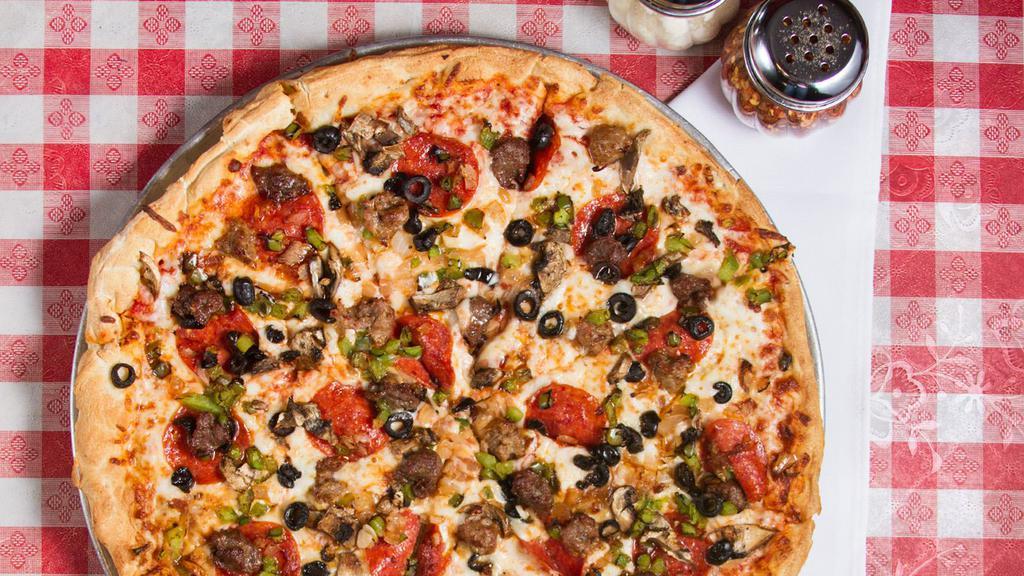 Italian Pie Combination Pizza · Classic House-Made Pizza Sauce Topped with Pepperoni, Italian Sausage, Ground Beef, Fresh Mushrooms, Sautéed Onions, Green Bell Peppers, Black Olives and Mozzarella.