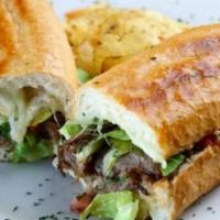 Roast Beef Poboy · Slow-Cooked Roast Beef with Gravy, Topped with Mozzarella, Shredded Lettuce, Fresh Tomato an...