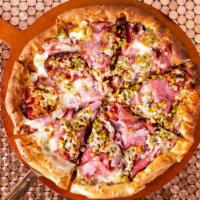 Muffuletta Pizza · Zesty Garlic Sauce Topped with Genoa Salami, Ham, Mozzarella and Our Own Olive Salad Mix.