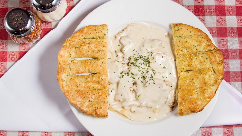 Fettuccini Alfredo · With a Hint of Pepper, Our Rich and Creamy Alfredo Sauce is Served Atop Your Choice of Marinated Chicken Breast or Seasoned Shrimp and Nestled on a Bed of Fettuccini. Served with Your Choice of Caesar, Mediterranean or Italian Salad and Your Choice of Fresh-Baked Breadsticks or Garlic Bread.