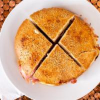 Real N'Awlins Muffuletta · A  Homemade Olive Salad Spread on Fresh Traditional Muffuletta Bread Which is then Layered w...