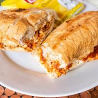 Chicken Parmesan Poboy · Marinated Roasted Chicken Breast Smothered in Our Signature Marinara Sauce, Topped with Mozz...