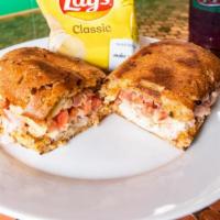 Roasted Turkey Focaccia  Sandwich · Roasted Turkey Breast and Crumbled Bacon on Herbed Focaccia. Topped with Mozzarella, Shredde...