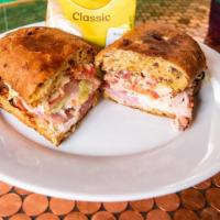 Club Focaccia Sandwich · Roasted Turkey and Baked Ham with Crumbled Bacon on Herbed Focaccia with Mozzarella, Shredde...