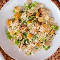Large Caesar Salad · Crisp Romaine Lettuce Tossed with Caesar Dressing and Topped with Shredded Parmesan and Crou...