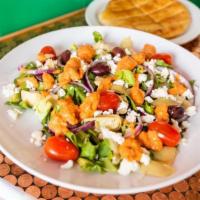 Small Mediterranean Salad · Crisp Romaine Lettuce Tossed with Grape Tomatoes, Red Onions, Artichoke Hearts, Kalamata Oli...