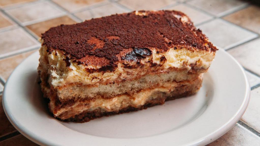 Italian Pie Tiramisu · Clouds of Light Mascarpone Cream on Pillows of Coffee, Rum-Soaked Lady Fingers and Finished with Powdered Sugar