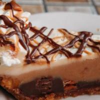 Chocolate Peanut Butter Pie · The Popular Candy Bar in a Pie. Dark Chocolate and Peanut Butter Mousse full of Reese's Pean...