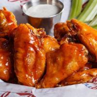 Wings Traditional Bone-In · Traditional bone-in wings tossed in your favorite sauce.