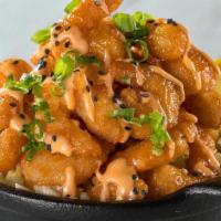 Ko Shrimp · Crispy shrimp tossed in a sweet, spicy, and creamy chili sauce..  Garnished with green onion...