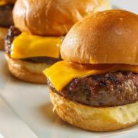Cheeseburger† Sliders · Three mini burgers with melted American cheese. (serves 2) .