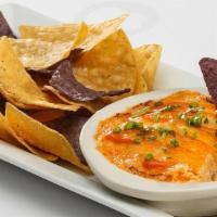 Buffalo Chicken Dip · Grilled chicken, mild buffalo sauce, and cream cheese. Served with tortilla chips. (serves 2...