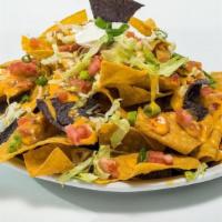 Gf Macho Nachos (Full Portion) · Tortilla chips topped with queso, lettuce, tomatoes, and sour cream.  Full Order (serves 4) .