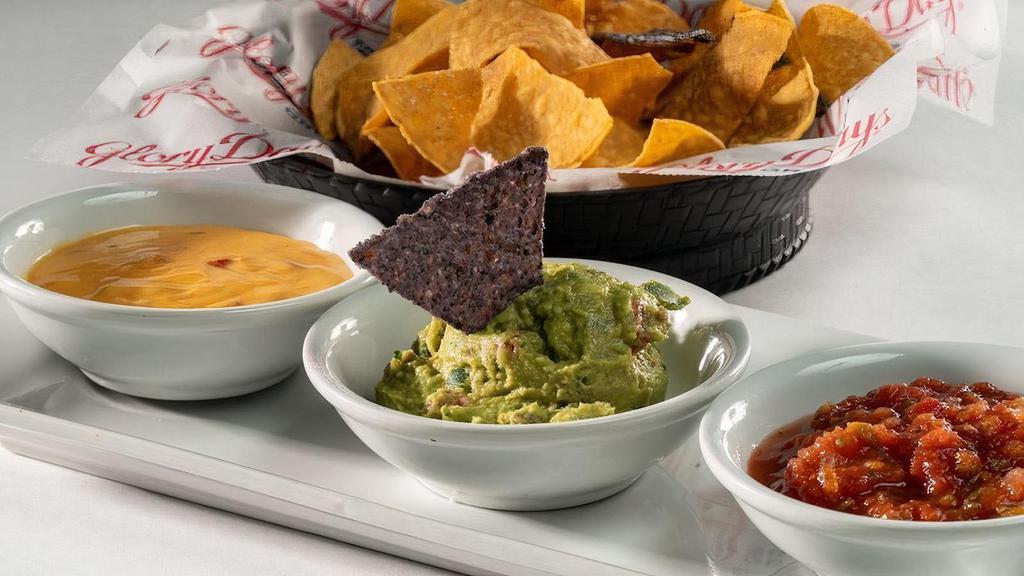Triple Crown · Tortilla chips with salsa, queso, and guacamole. (serves 2) .